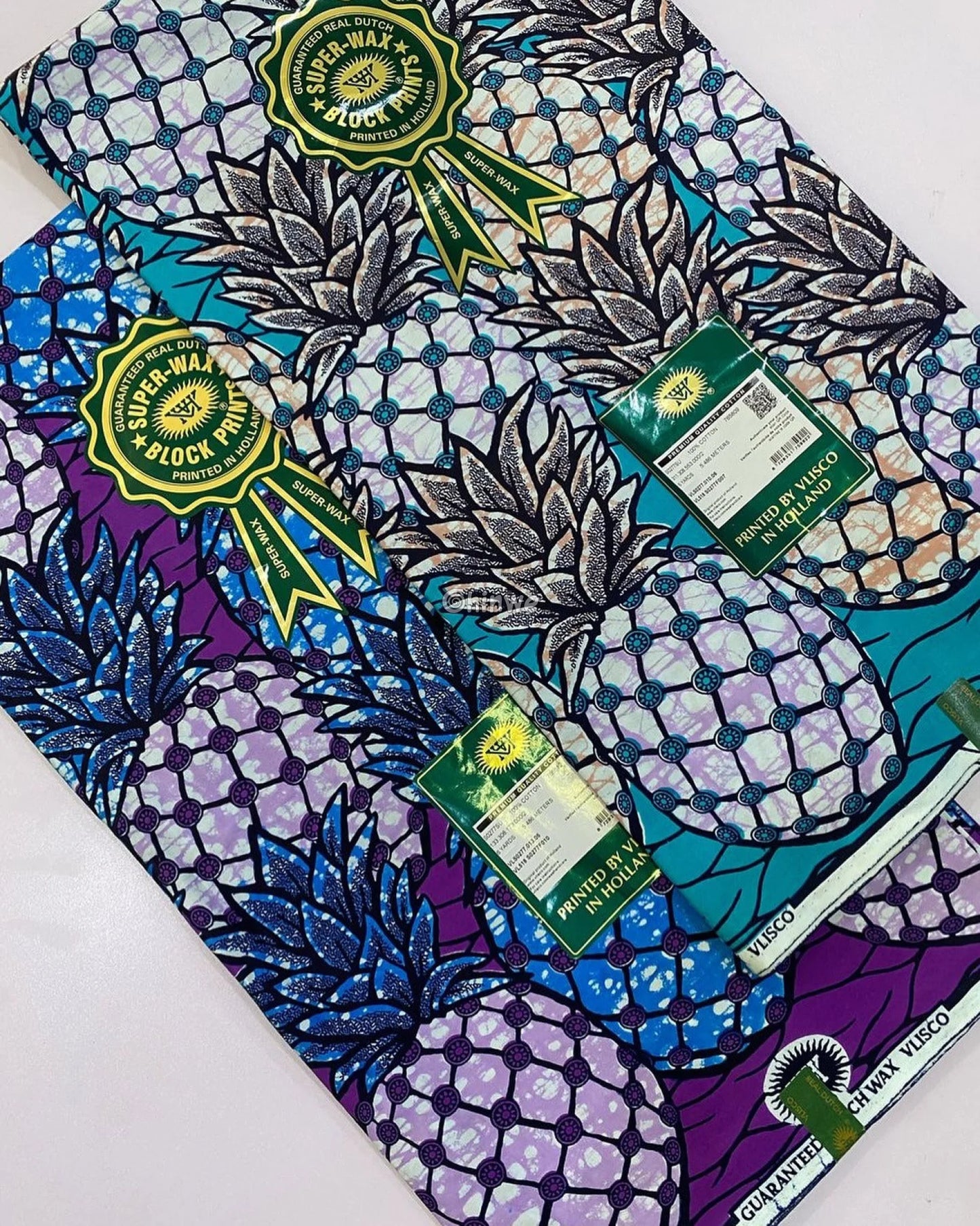 African Wax Print with Blue Pineapples and Sapphire Leaves on Purple Ground Circular Batik Detailing Royal Purple