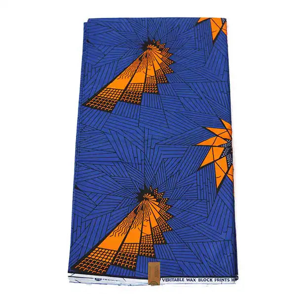 Royal blue Ankara wax print with orange starbursts, folded