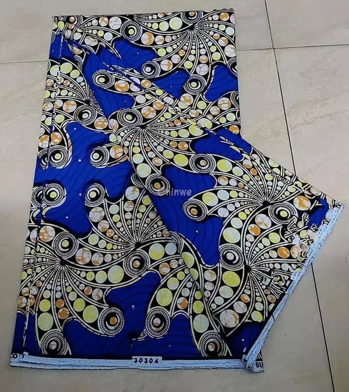 Blue and Yellow Ankara Fabric with Swirling Patterns