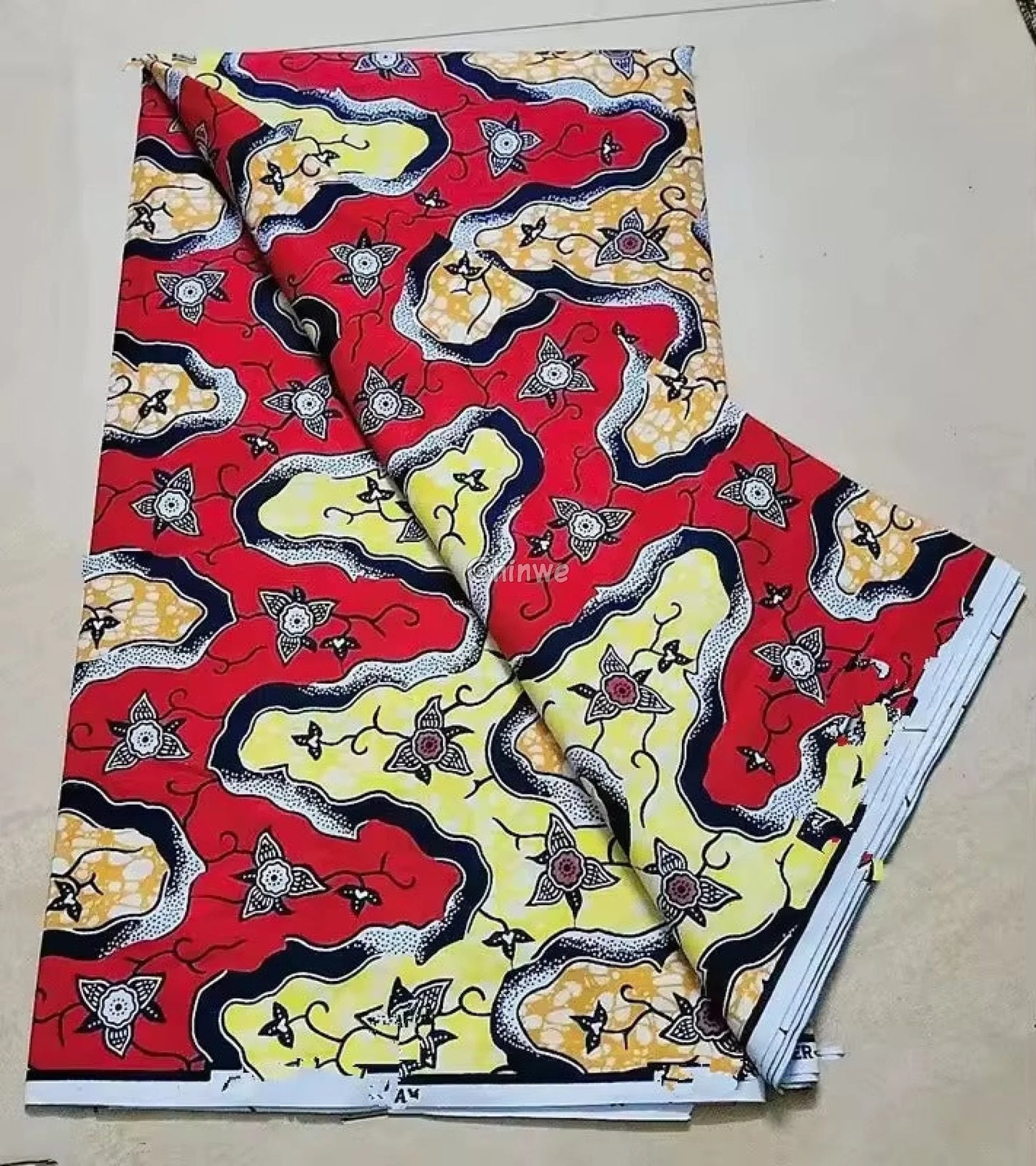Red and Yellow Floral Ankara Wax Print Fabric with Wave and Star Design