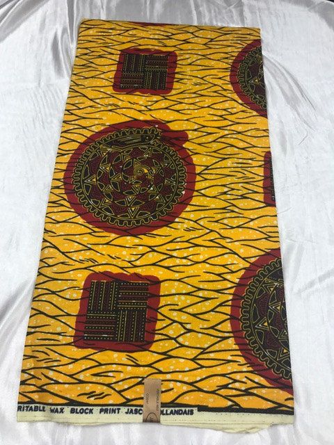 Yellow Ankara wax print laid flat