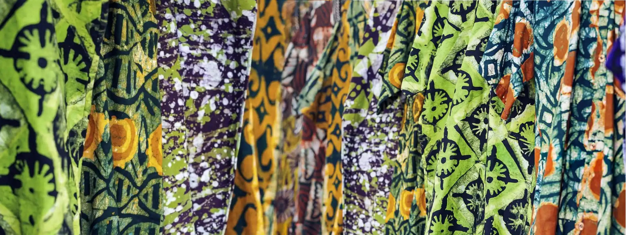Close-up of colorful patterned fabric with various designs.
