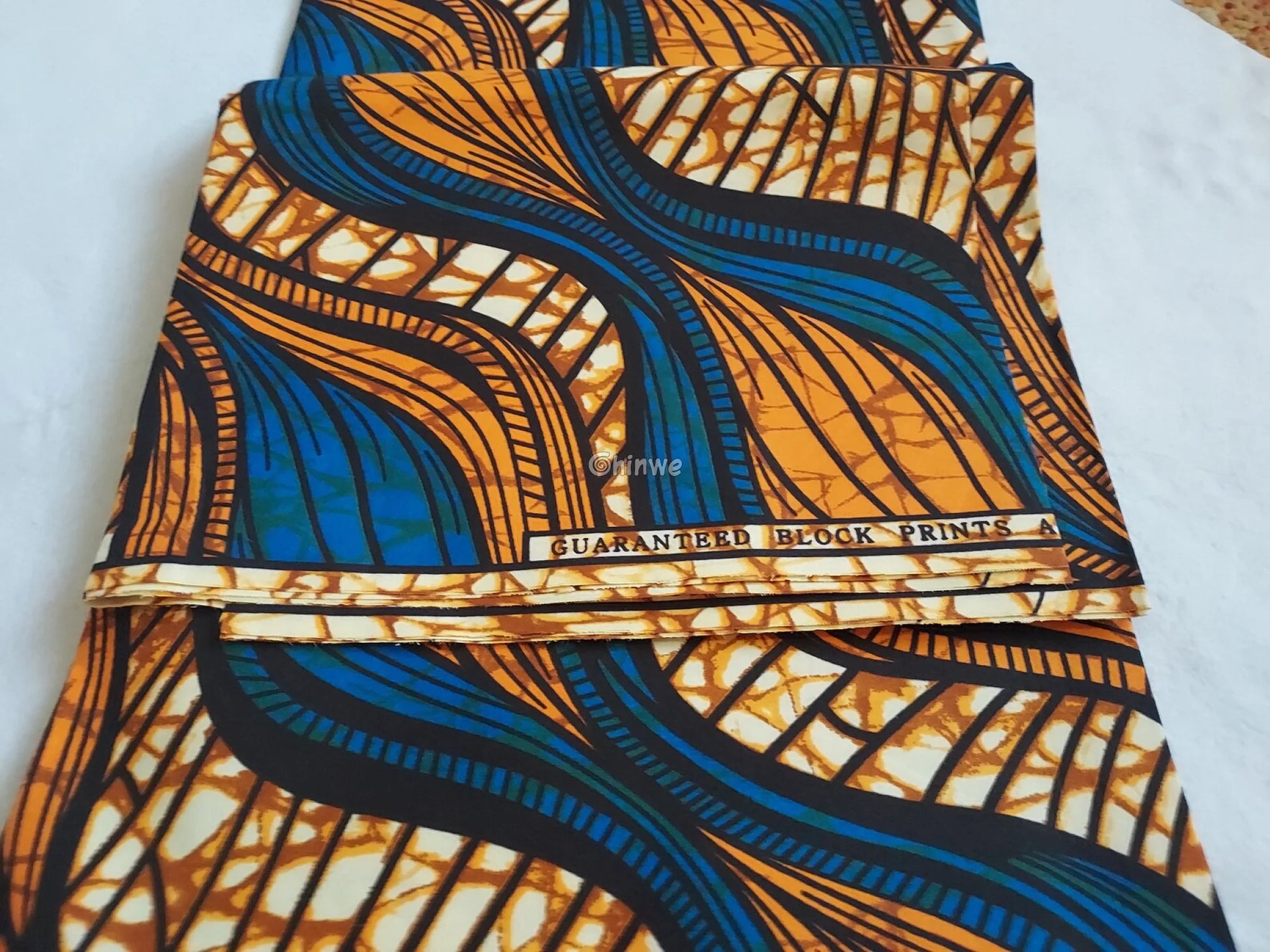Blue and Orange Ankara Wax Print Fabric with Abstract Flowing Lines22