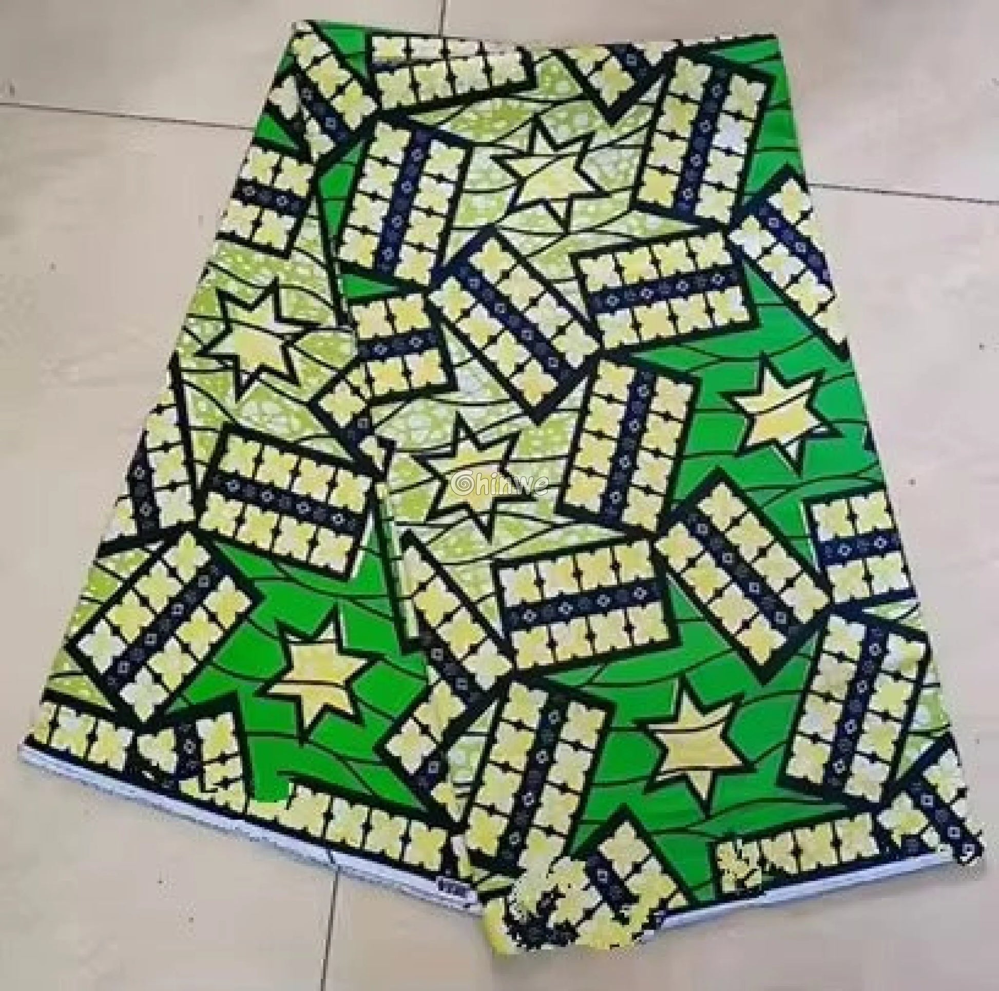 Green and Yellow Ankara Fabric with Star and Floral Patterns