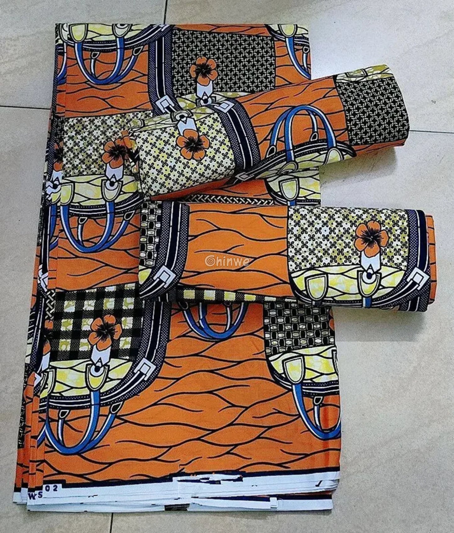 Orange and Black Checkered Ankara Wax Print Fabric with Bag and Flower Design