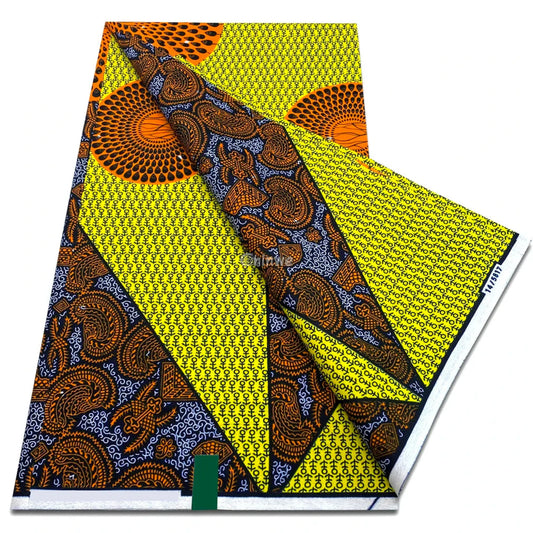 Yellow wax print with burnt orange sunburst medallions and indigo paisley on symbol grid background Golden Sunburst