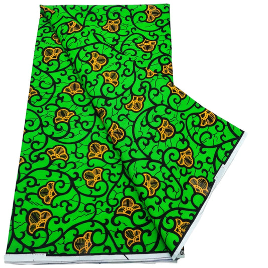 Lime green Ankara real wax print with black swirl vines and small orange flowers, 100% cotton, 6 yards