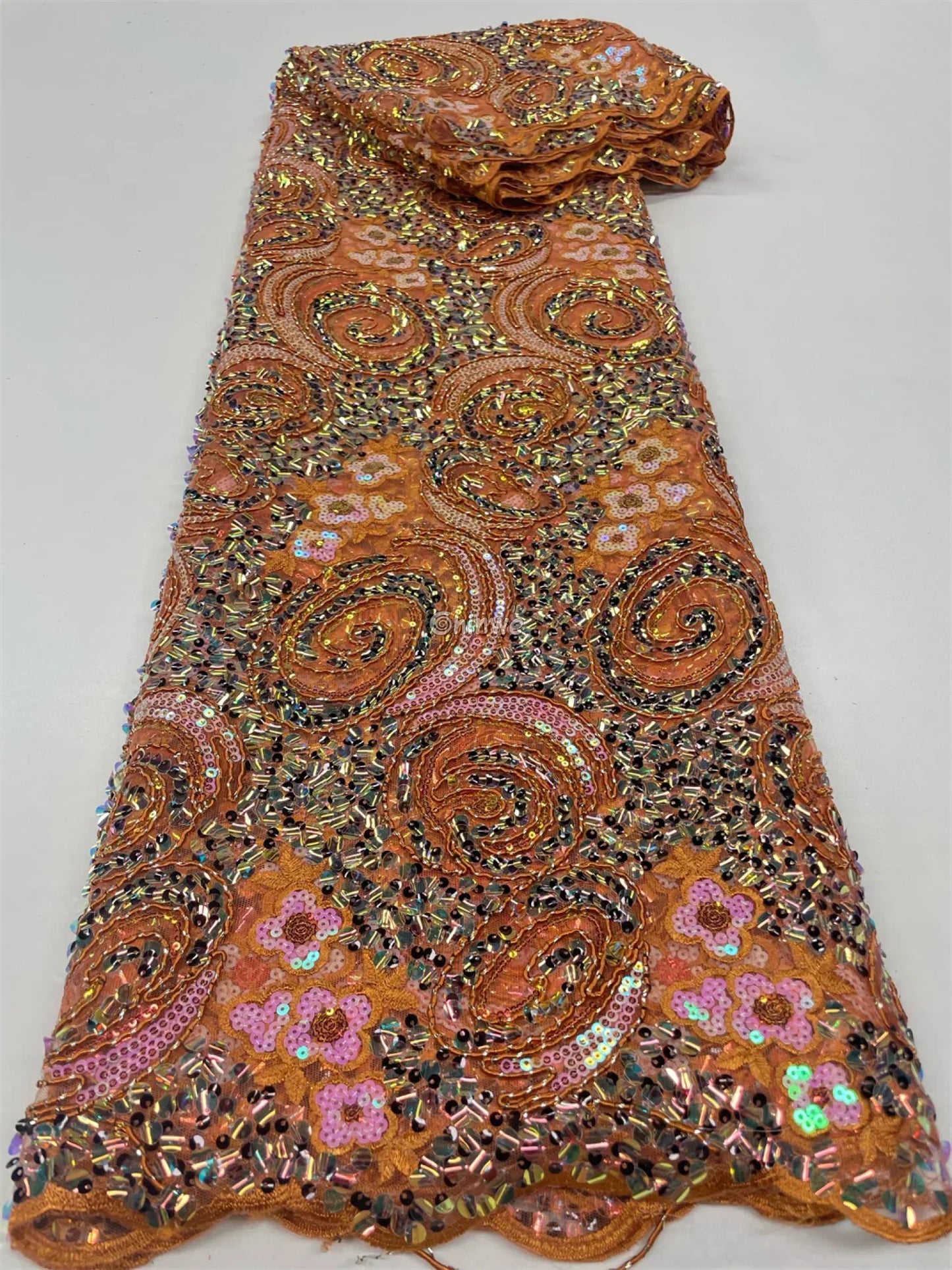 Sequined Spiral Paisley Lace with Beaded Floral Detailing on Sheer Mesh Base Burnt orange with pink floral swirl