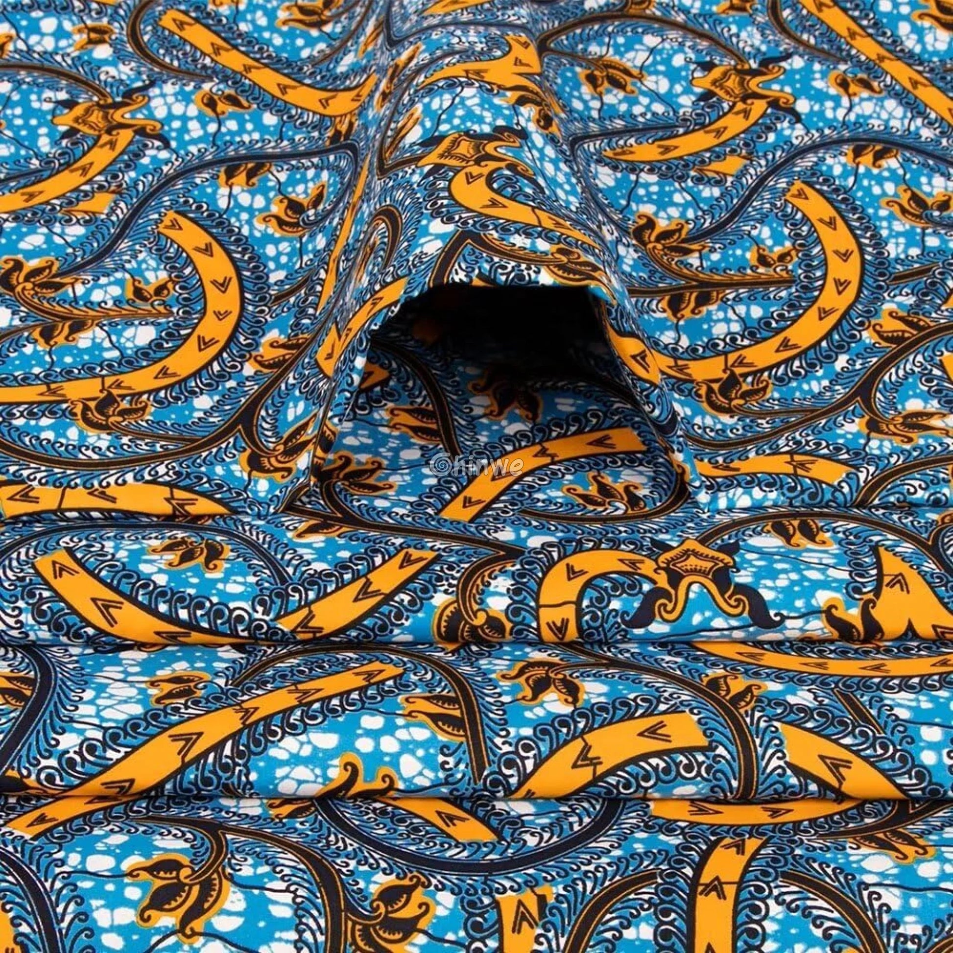 Vibrant Design

Unique Textile

Swirling Patterns

Sewing Fabric

Quilting Material

Nigerian Textile

Flowing Patterns

Fashion Fabric

Elegant Fabric

DIY Projects

Decorative Print

Craft Material

Bold Swirls

Blue and Gold Fabric

Ankara Wax Print