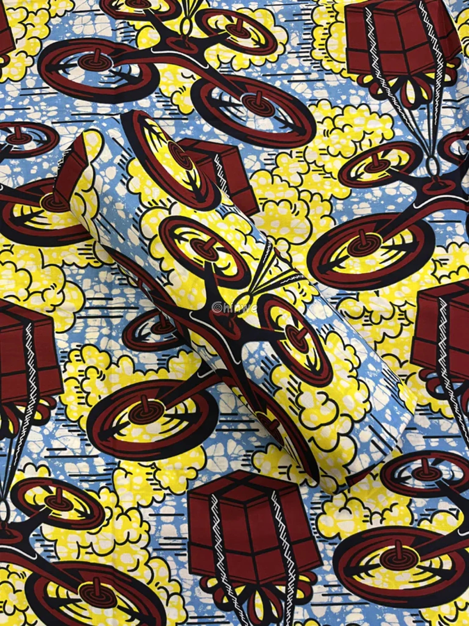 Crimson Drone & Parcel Motif on Sky Blue with Yellow Cloud Bursts and White Crackle Batik Detailing Sky Blue Delivery