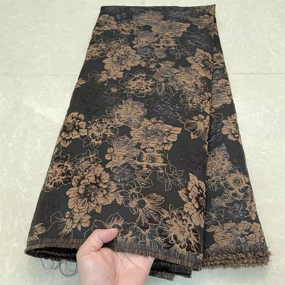 Metallic jacquard damask with raised floral pattern and gilded finish embroidered on tulle base