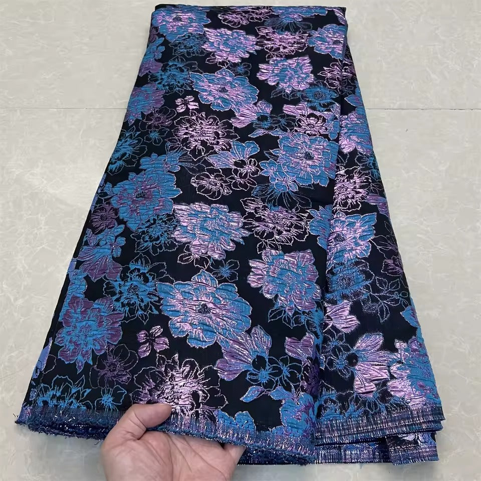 Metallic jacquard damask with raised floral pattern and gilded finish embroidered on tulle base