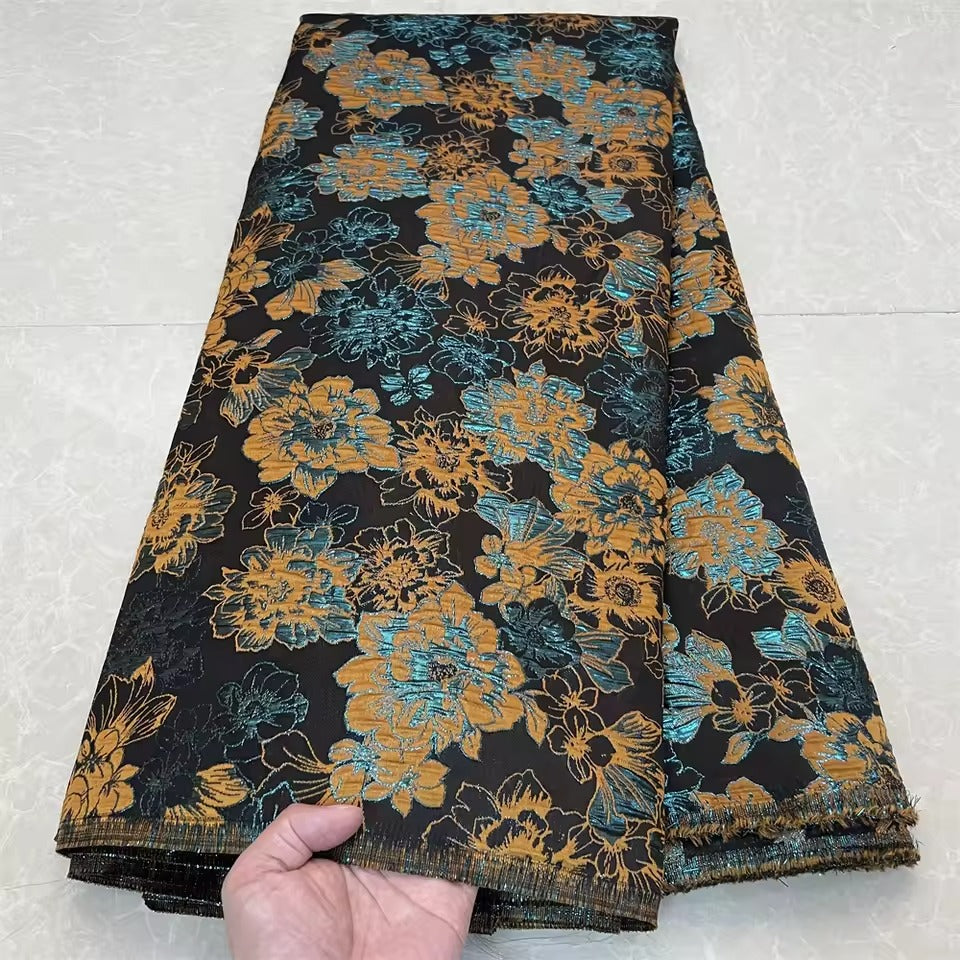 Metallic jacquard damask with raised floral pattern and gilded finish embroidered on tulle base