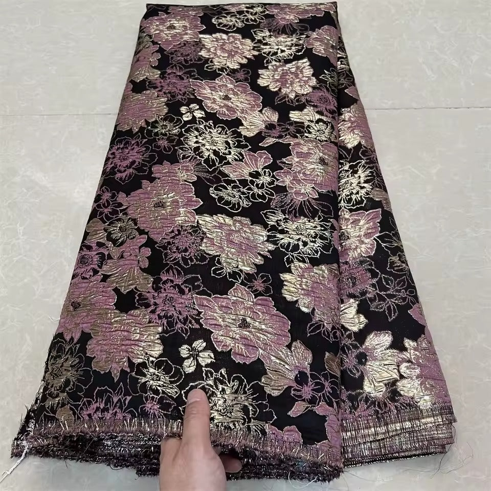 Metallic jacquard damask with raised floral pattern and gilded finish embroidered on tulle base
