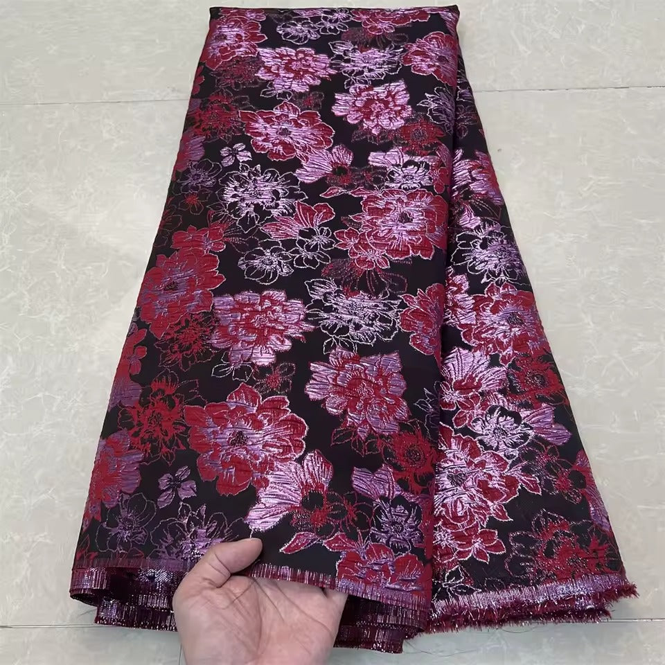 Metallic jacquard damask with raised floral pattern and gilded finish embroidered on tulle base