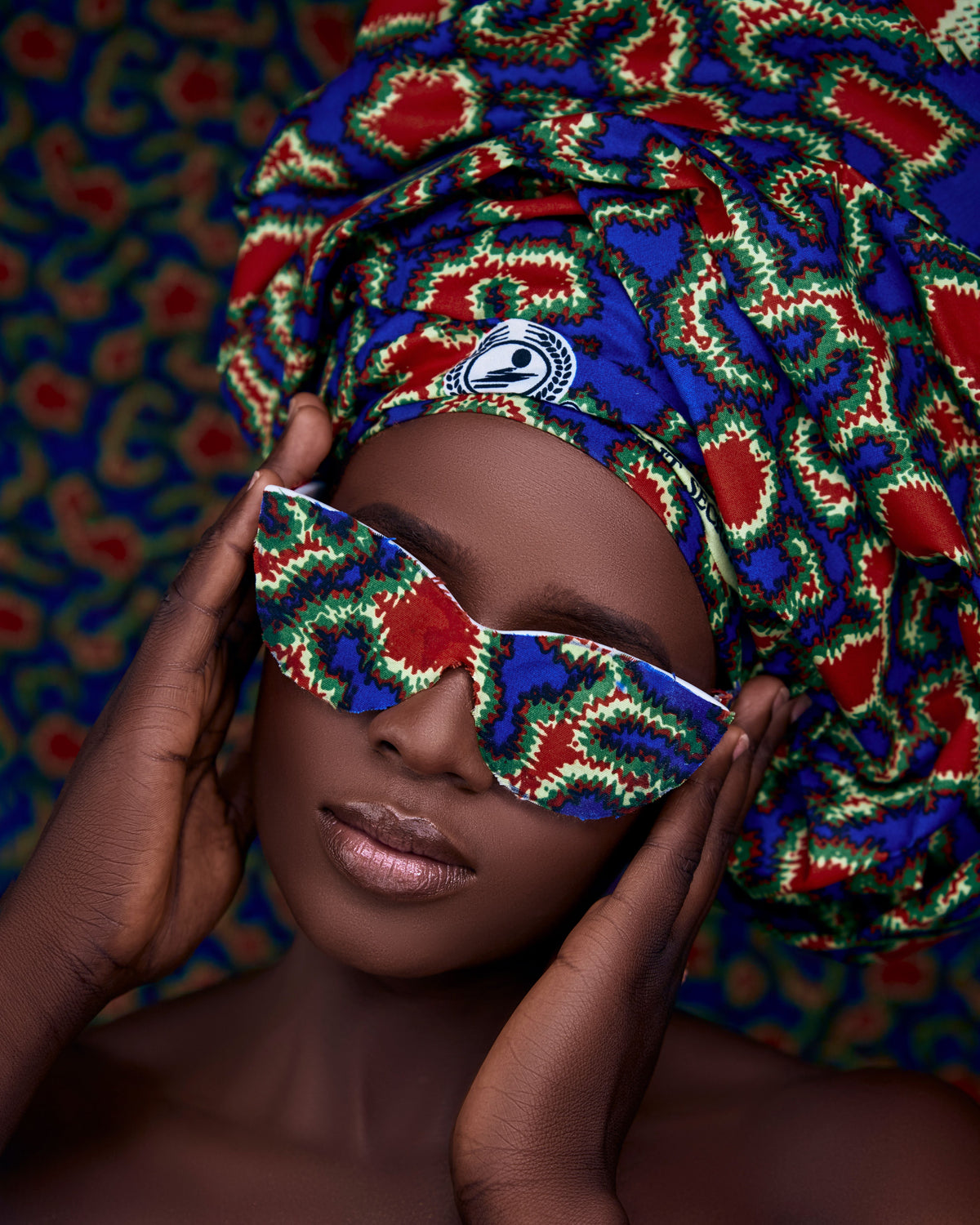 Fashion inspiration: a blue, green and red wax-print head wrap with matching sunglasses.