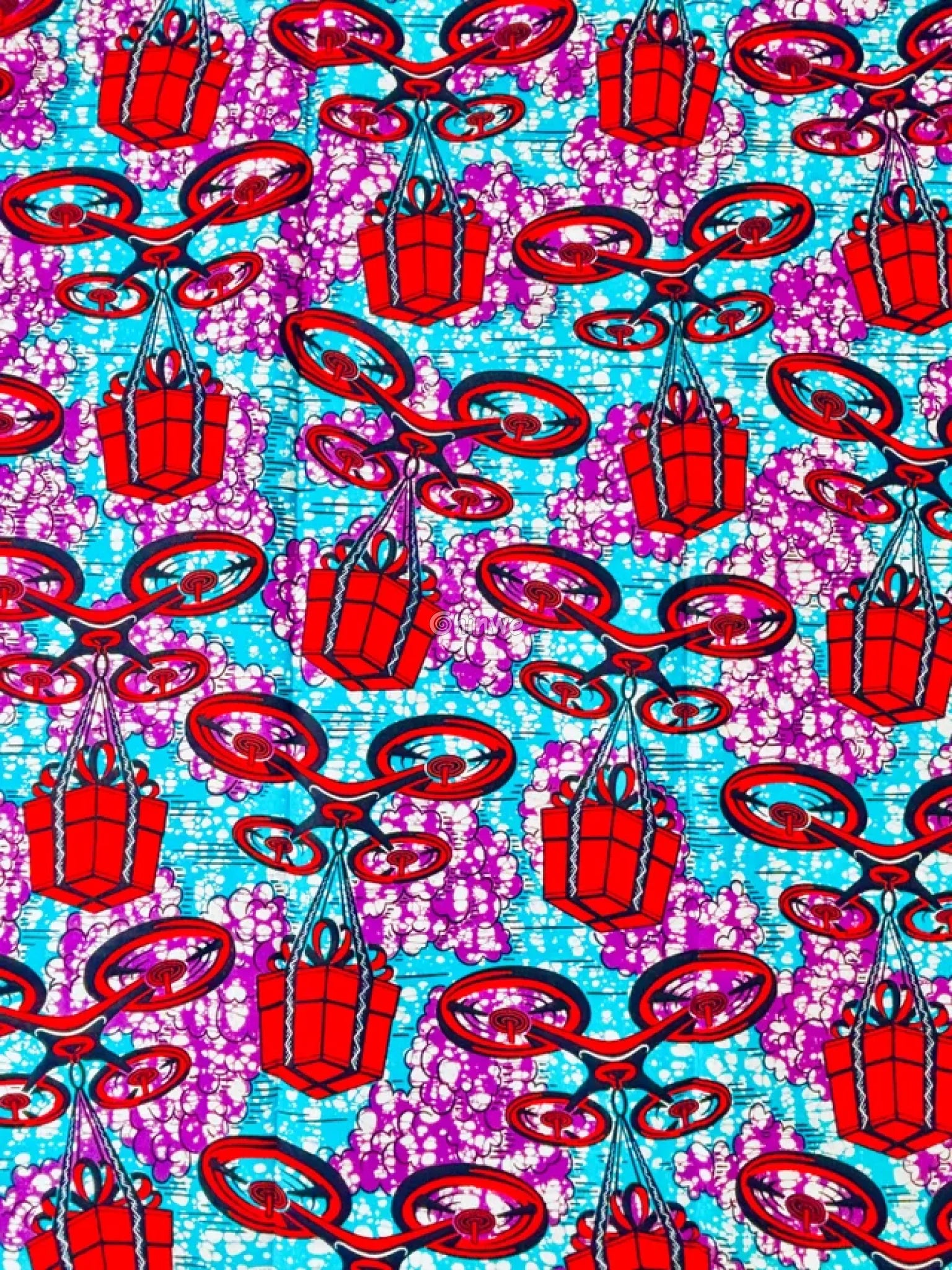 African Wax Print with Red Parcel Drones and Lilac Smoke on Sky Blue Batik Ground Tech-Inspired Motif Lavender Drone