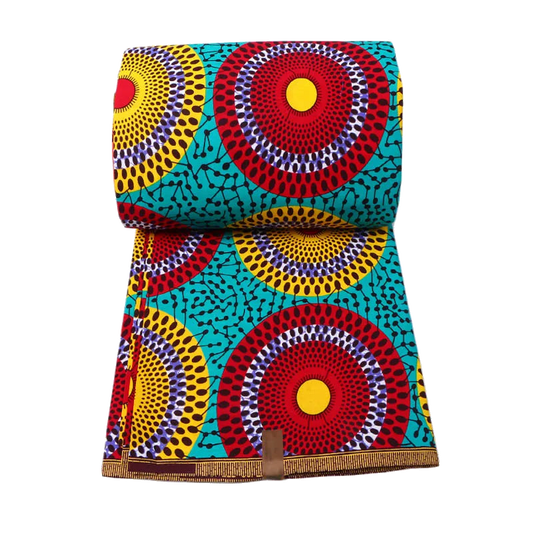 Teal Ankara wax print fabric with red, yellow and purple sunburst circles, rolled